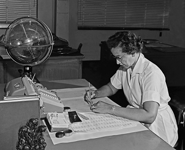 Here, Johnson is demonstrating her hard work.  (https://www.nasa.gov/image-feature/katherine-johns ())